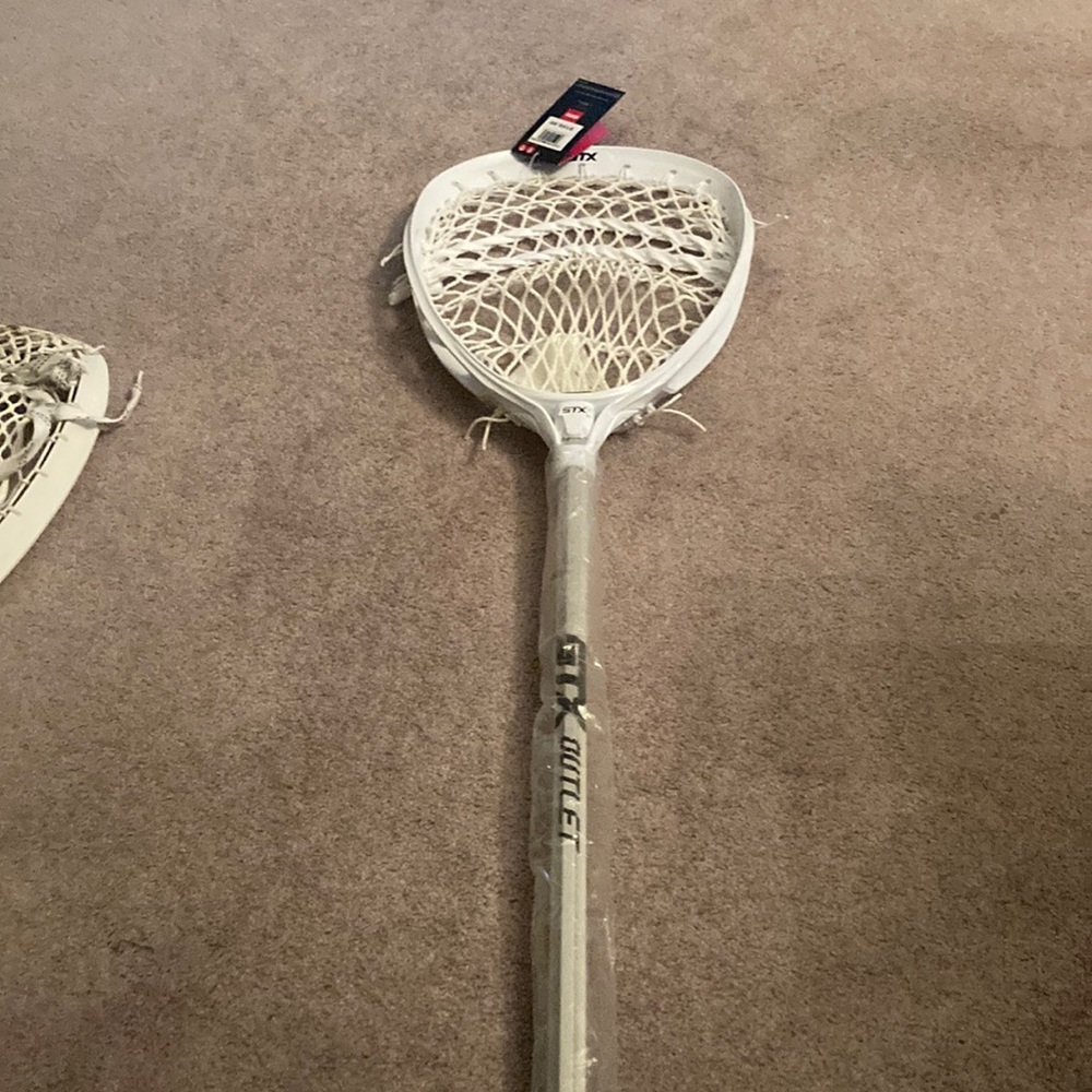 Brand new STX women’s or men’s lacrosse goalie stick.